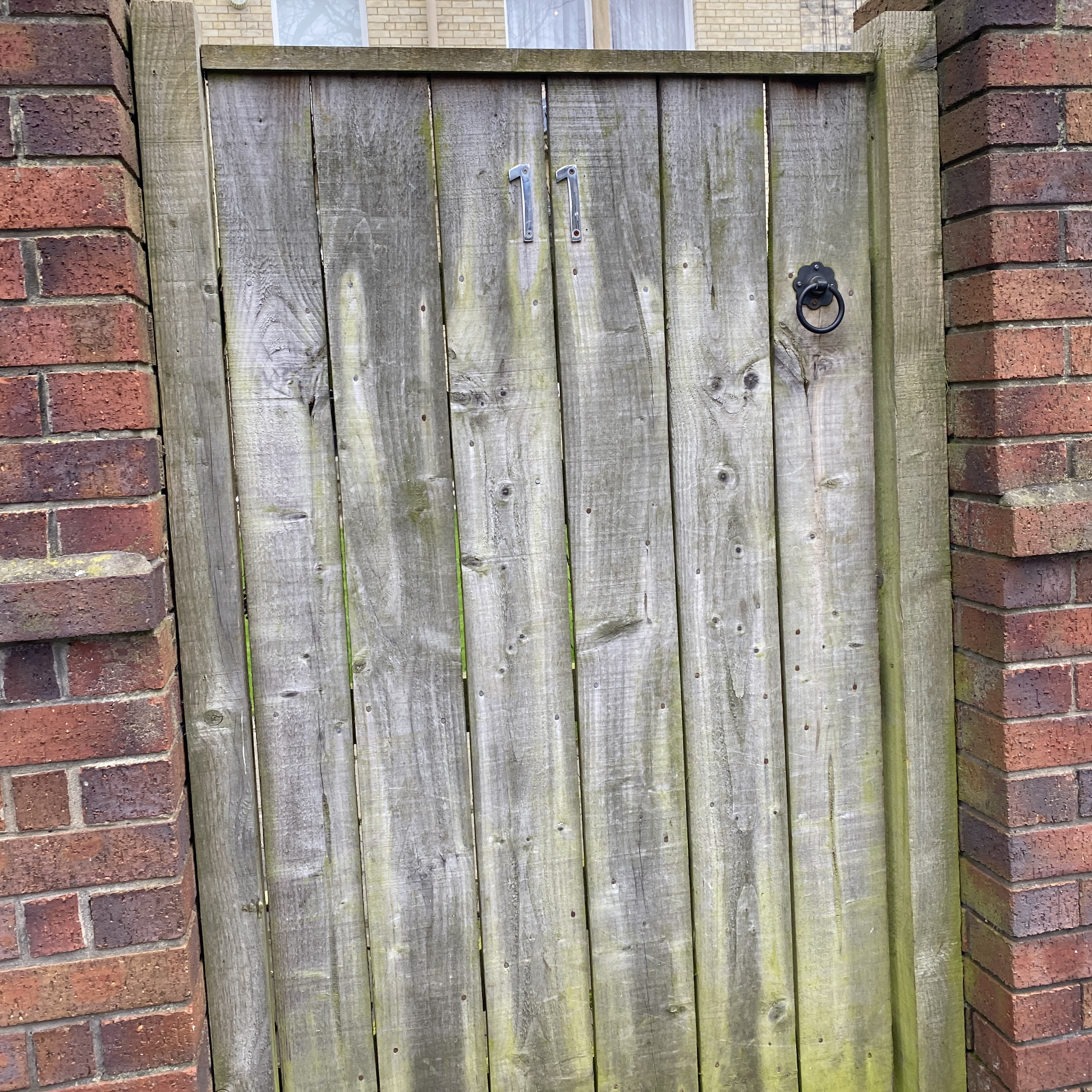 Weathered old wooden gate ready for replacement